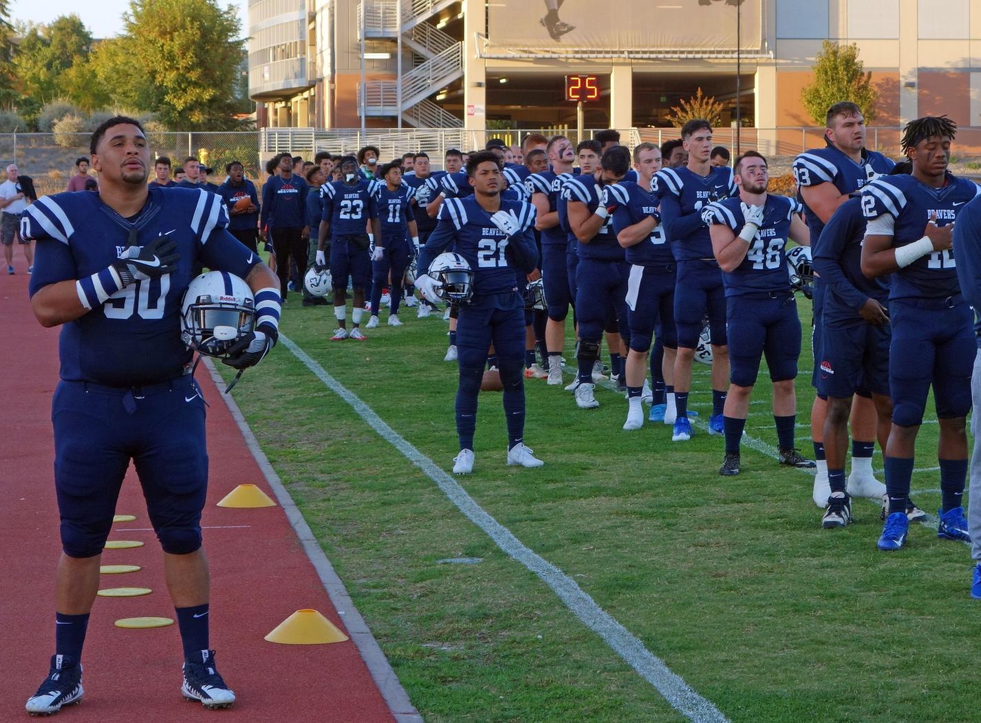 ARC Football Team standing during the National Anthem